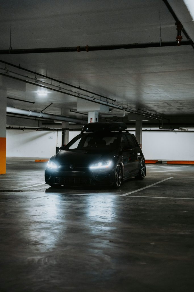 A car is parked in a parking garage